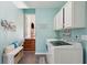 Laundry room with a white bench and stairs leading upstairs at 1336 Battle Ground Rd, Charleston, SC 29412