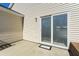 Exterior view of back patio with sliding glass door and adjacent home siding at 139 Blue Jasmine Ln, Summerville, SC 29483
