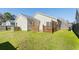 A well-maintained backyard and partially enclosed patio area at 139 Blue Jasmine Ln, Summerville, SC 29483