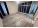 Primary bedroom with grey wood-look flooring and blue accent wall at 139 Blue Jasmine Ln, Summerville, SC 29483