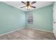Bedroom features a ceiling fan, a window, and stylish wood-look floors at 139 Blue Jasmine Ln, Summerville, SC 29483