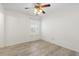 Bedroom features a ceiling fan, a window, and stylish wood-look floors at 139 Blue Jasmine Ln, Summerville, SC 29483