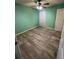 Spacious bedroom with light-grey wood-look flooring and a ceiling fan at 139 Blue Jasmine Ln, Summerville, SC 29483