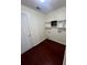 Laundry room with wood flooring and shelving at 139 Blue Jasmine Ln, Summerville, SC 29483
