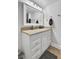 Bright bathroom featuring granite countertop and white cabinets at 14 Lockwood Dr # 6H, Charleston, SC 29401
