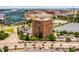 Aerial view of a multi-story building near a roadway and body of water at 14 Lockwood Dr # 6H, Charleston, SC 29401