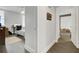 Bright hallway with hardwood floors and access to bedrooms at 14 Lockwood Dr # 6H, Charleston, SC 29401