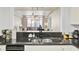 Kitchen features granite counters and breakfast bar at 14 Lockwood Dr # 6H, Charleston, SC 29401