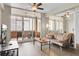 Living room with sofa, TV, and access to balcony at 14 Lockwood Dr # 6H, Charleston, SC 29401