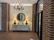 Elegant lobby with chandelier, mirror, and console table at 14 Lockwood Dr # 6H, Charleston, SC 29401