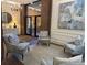Lobby sitting area with comfortable chairs and patterned rug at 14 Lockwood Dr # 6H, Charleston, SC 29401