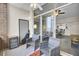 Private patio with two wicker chairs and a mini-fridge at 14 Lockwood Dr # 6H, Charleston, SC 29401