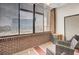 Relaxing sunroom with city views and comfortable seating at 14 Lockwood Dr # 6H, Charleston, SC 29401