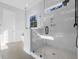 Bright bathroom with a glass-enclosed shower and window at 1461 Lieben Rd, Mount Pleasant, SC 29466