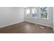 Spacious bedroom with hardwood floors and multiple windows at 1461 Lieben Rd, Mount Pleasant, SC 29466