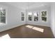 Spacious bedroom with hardwood floors, large windows, and ceiling fan at 1461 Lieben Rd, Mount Pleasant, SC 29466