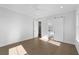 Bright bedroom with hardwood floors, large windows, and sliding barn door to bathroom at 1461 Lieben Rd, Mount Pleasant, SC 29466