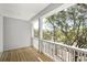 Wooden deck with white railings and treetop views at 1461 Lieben Rd, Mount Pleasant, SC 29466