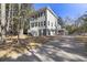 Two-story house exterior showcasing gray siding, large windows, and a wraparound porch at 1461 Lieben Rd, Mount Pleasant, SC 29466