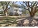 Two-story house exterior with gray siding, large windows, and a wraparound porch at 1461 Lieben Rd, Mount Pleasant, SC 29466