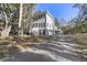 Two-story house exterior with gray siding, large windows, and a gravel driveway at 1461 Lieben Rd, Mount Pleasant, SC 29466