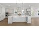 Modern kitchen with white cabinets, quartz countertops and stainless steel appliances at 1461 Lieben Rd, Mount Pleasant, SC 29466