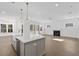 Open concept kitchen boasts an island, stainless steel appliances, and hardwood floors at 1461 Lieben Rd, Mount Pleasant, SC 29466