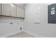 Bright laundry room, featuring upper cabinets and tile flooring at 1461 Lieben Rd, Mount Pleasant, SC 29466