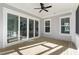 Spacious screened porch with wood decking and sliding glass doors at 1461 Lieben Rd, Mount Pleasant, SC 29466