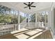 Relaxing screened porch with wood flooring and ceiling fan at 1461 Lieben Rd, Mount Pleasant, SC 29466