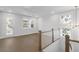Bright upper hall with hardwood floors and access to bedrooms at 1461 Lieben Rd, Mount Pleasant, SC 29466