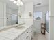 Clean bathroom with white tile, pedestal sink, and shower/tub combo at 15 31St Ave, Isle of Palms, SC 29451