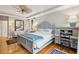 Elegant bedroom featuring a king-size bed, built in desk and hardwood floors at 15 31St Ave, Isle of Palms, SC 29451
