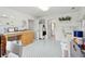 Well-lit craft room with built-in cabinets, checkerboard floor, and adjacent bathroom at 15 31St Ave, Isle of Palms, SC 29451