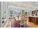Bright dining area with a farmhouse table and hardwood floors at 15 31St Ave, Isle of Palms, SC 29451