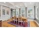 Charming dining area with a rustic table and French chairs at 15 31St Ave, Isle of Palms, SC 29451