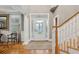 Bright entryway with hardwood floors, white columns, and a grand staircase at 15 31St Ave, Isle of Palms, SC 29451