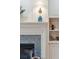 Detailed view of fireplace with decorative mantel and shelving at 15 31St Ave, Isle of Palms, SC 29451