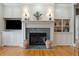 Elegant fireplace with built-in shelving and a marble surround at 15 31St Ave, Isle of Palms, SC 29451