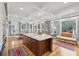 Spacious kitchen with island, stainless steel appliances, and hardwood floors at 15 31St Ave, Isle of Palms, SC 29451