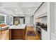 Bright kitchen featuring white cabinets, marble countertops, and a Wolf range at 15 31St Ave, Isle of Palms, SC 29451