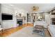 Open living space with built-ins, fireplace, and hardwood floors at 15 31St Ave, Isle of Palms, SC 29451