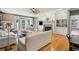 Open living area with fireplace, built-in shelving and hardwood floors at 15 31St Ave, Isle of Palms, SC 29451
