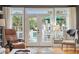 Bright living room with French doors opening to a deck and hardwood floors at 15 31St Ave, Isle of Palms, SC 29451