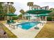 Refreshing pool and spa with multiple umbrellas at 15 31St Ave, Isle of Palms, SC 29451