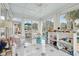 Sunroom with playful star floor, white furniture and large windows at 15 31St Ave, Isle of Palms, SC 29451