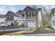 Two-story house with a gray exterior, white trim, and a two-car garage at 153 Instructor Ct, Ladson, SC 29456