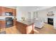 Modern kitchen with dark wood cabinets, black appliances, and an island at 153 Instructor Ct, Ladson, SC 29456