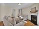 Bright living room with hardwood floors, fireplace, and comfortable seating at 153 Instructor Ct, Ladson, SC 29456