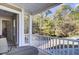 Private porch overlooking wooded backyard with seating area at 153 Instructor Ct, Ladson, SC 29456